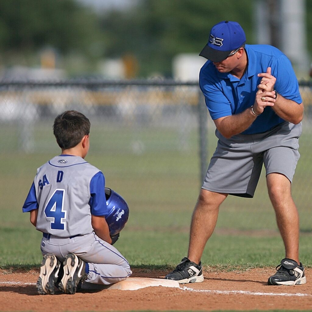 baseball, little league, sport, player, coach, game, boy, team, field, youth, uniform, base, kid, summer, coaching, helmet, nature, athletic, fun, childhood, male, ballpark, competition, blue, batter, action